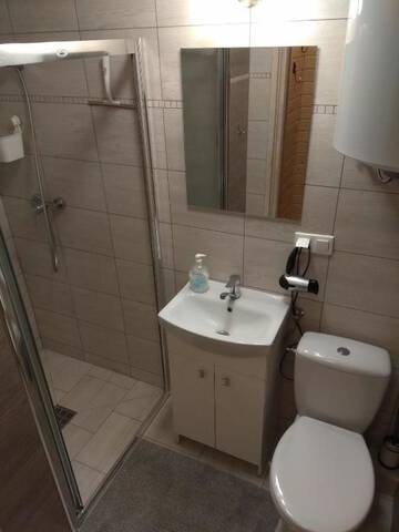 Фото номера Дом с 2 спальнями Дома для отпуска Leśny Zakątek Sztutowo г. Штутово 18
